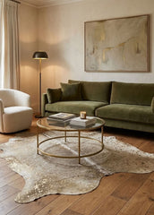 gold acid washed cowhide rug in living room