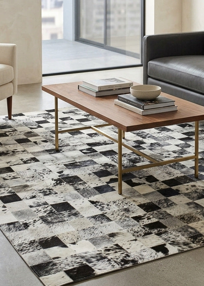 Stitched cowhide rug in living room