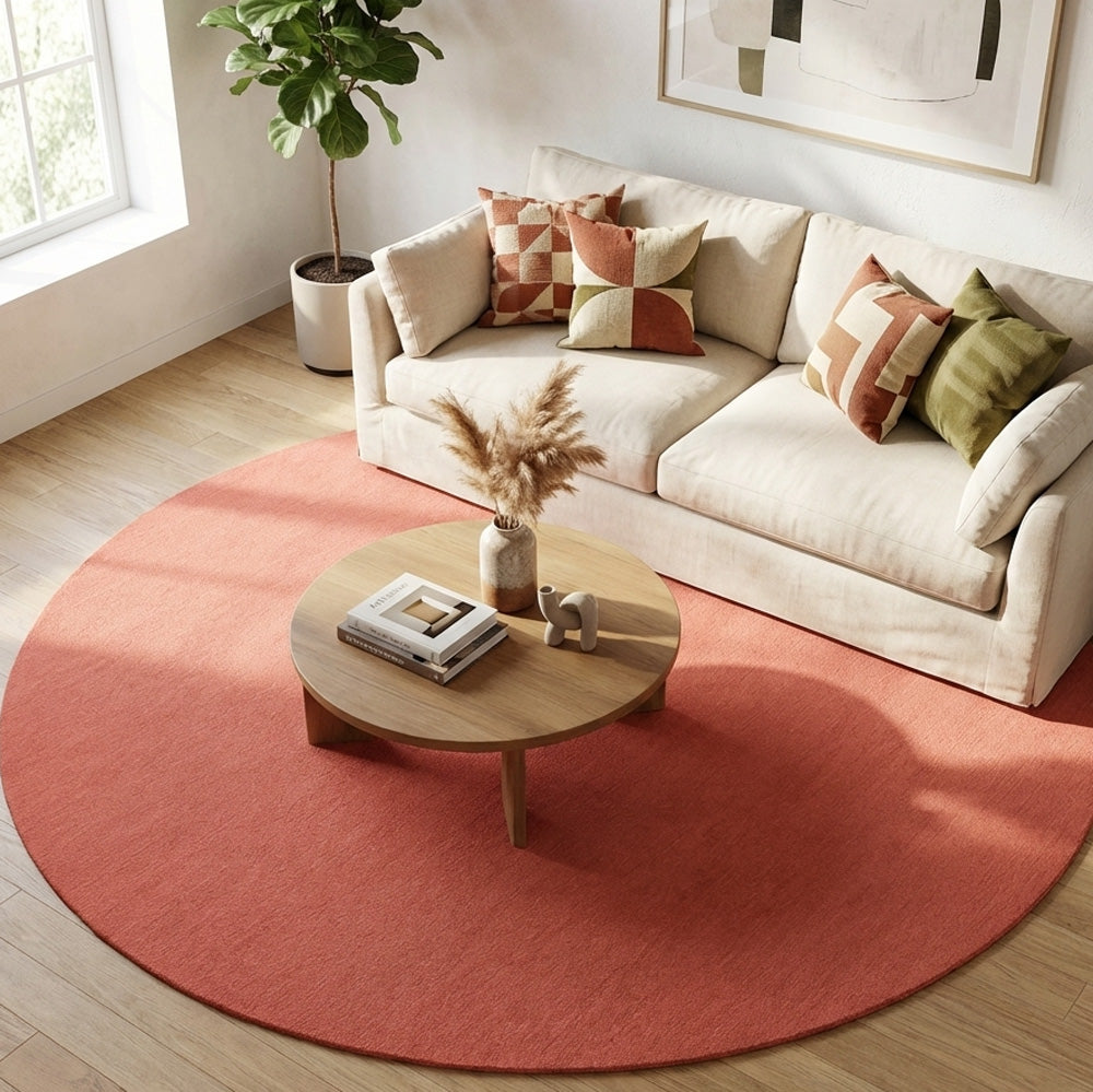 Pink round wool rug in living rug