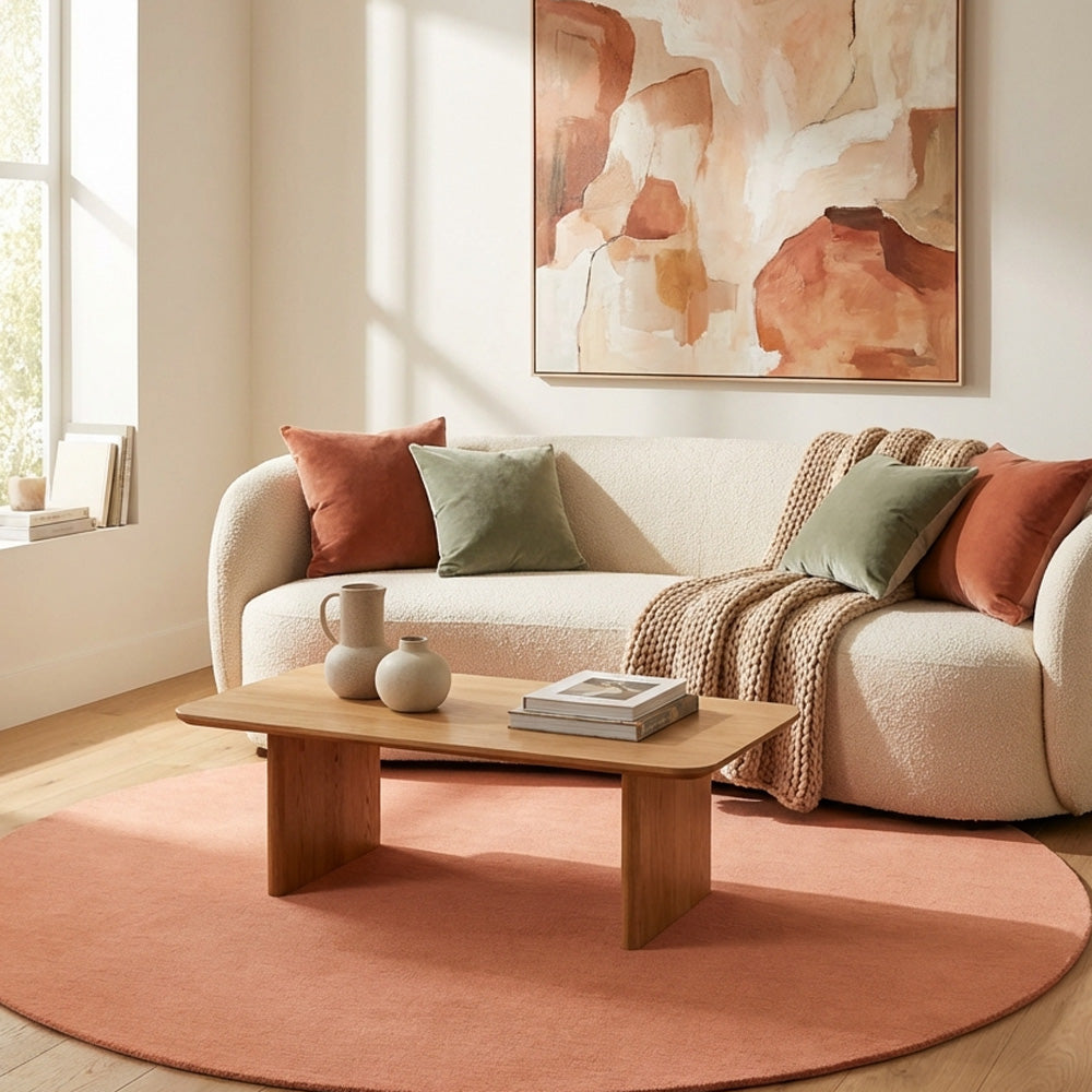 Hand tufted pink round wool rug in modern living room