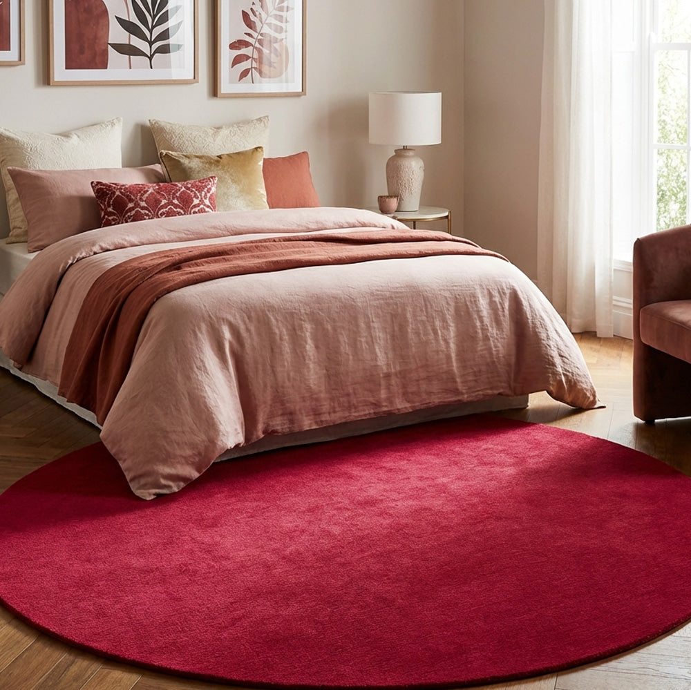 Red round wool rug in modern bedroom
