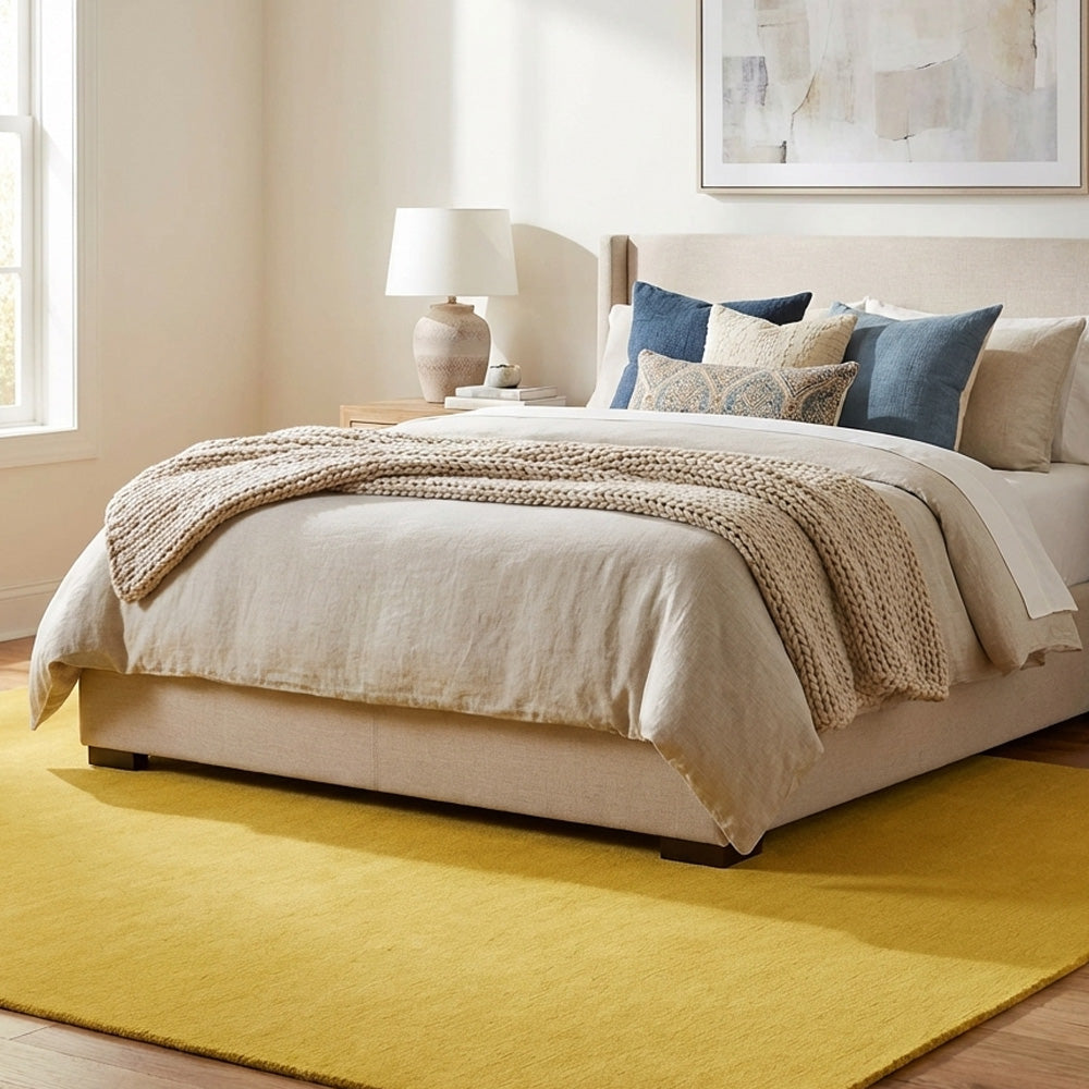 yellow wool rug in bedroom