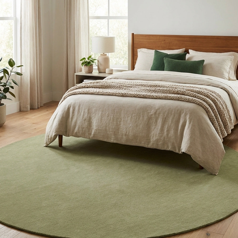 Olive green round wool rug in modern bedroom