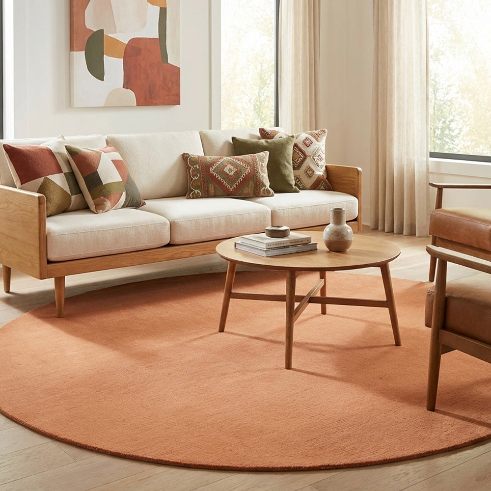 Orange round wool rug in living room