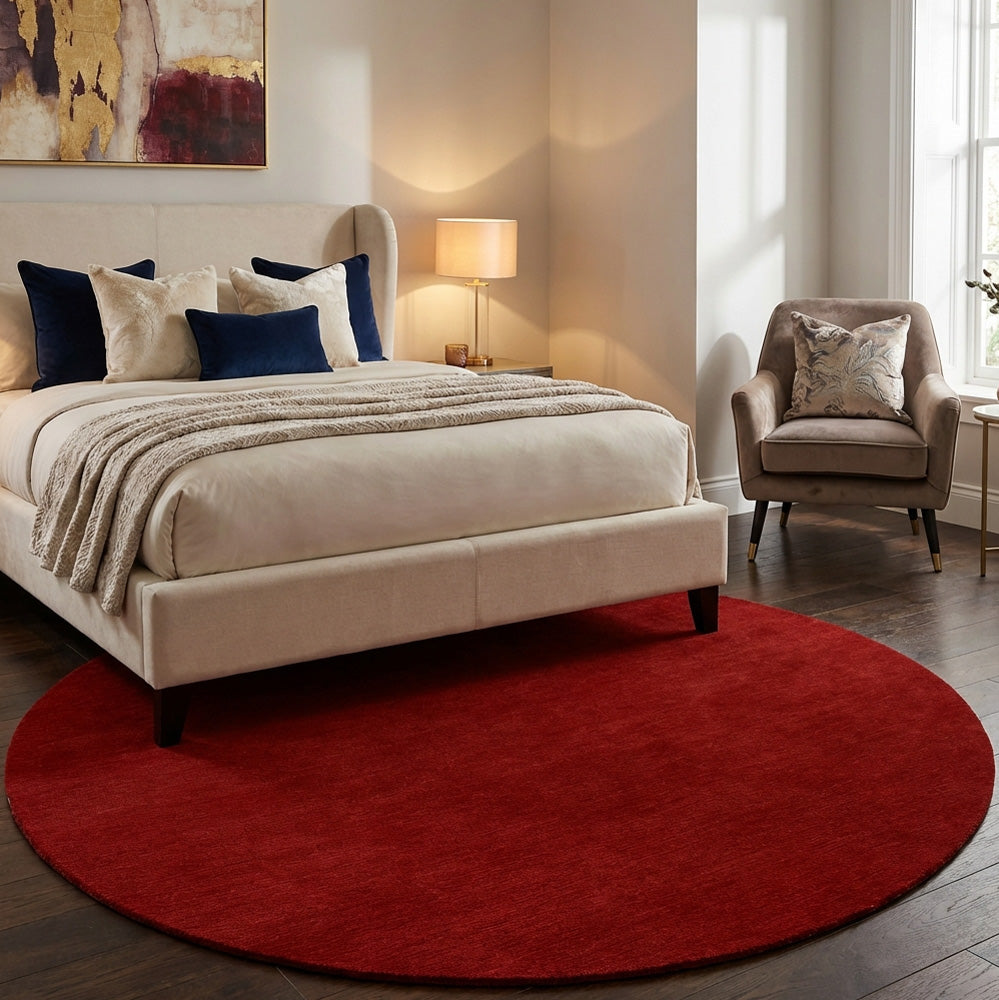 Red round wool rug in modern bedroom