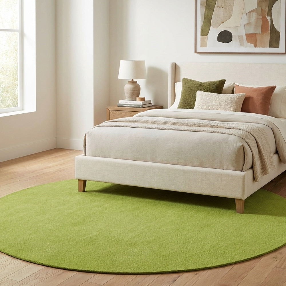 Green round wool rug in modern bedroom