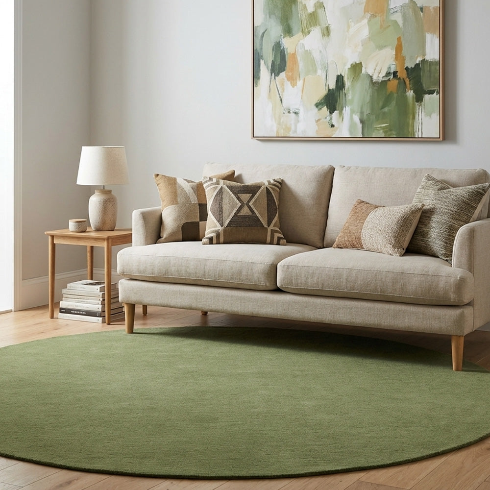 Pesto green round wool rug in living room