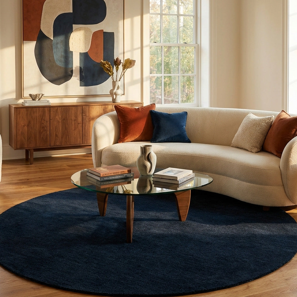 Navy blue round wool rug in living room
