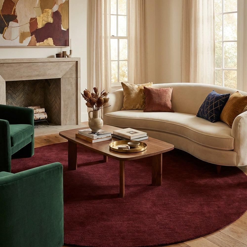 Deep maroon round wool rug in modern living room