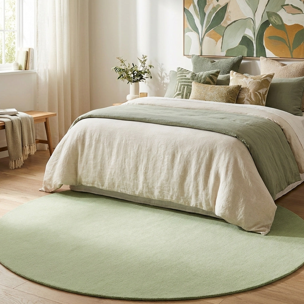 round green rug in a bright bedroom.