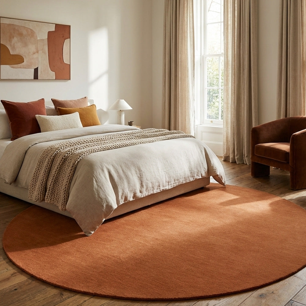 apricot modern round wool rug in bedroom