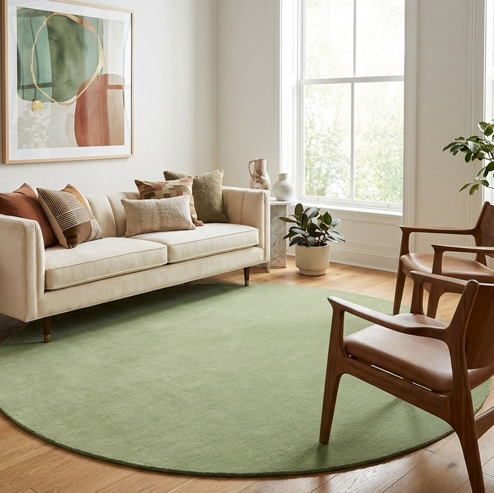 Sage green round wool rug in modern living room