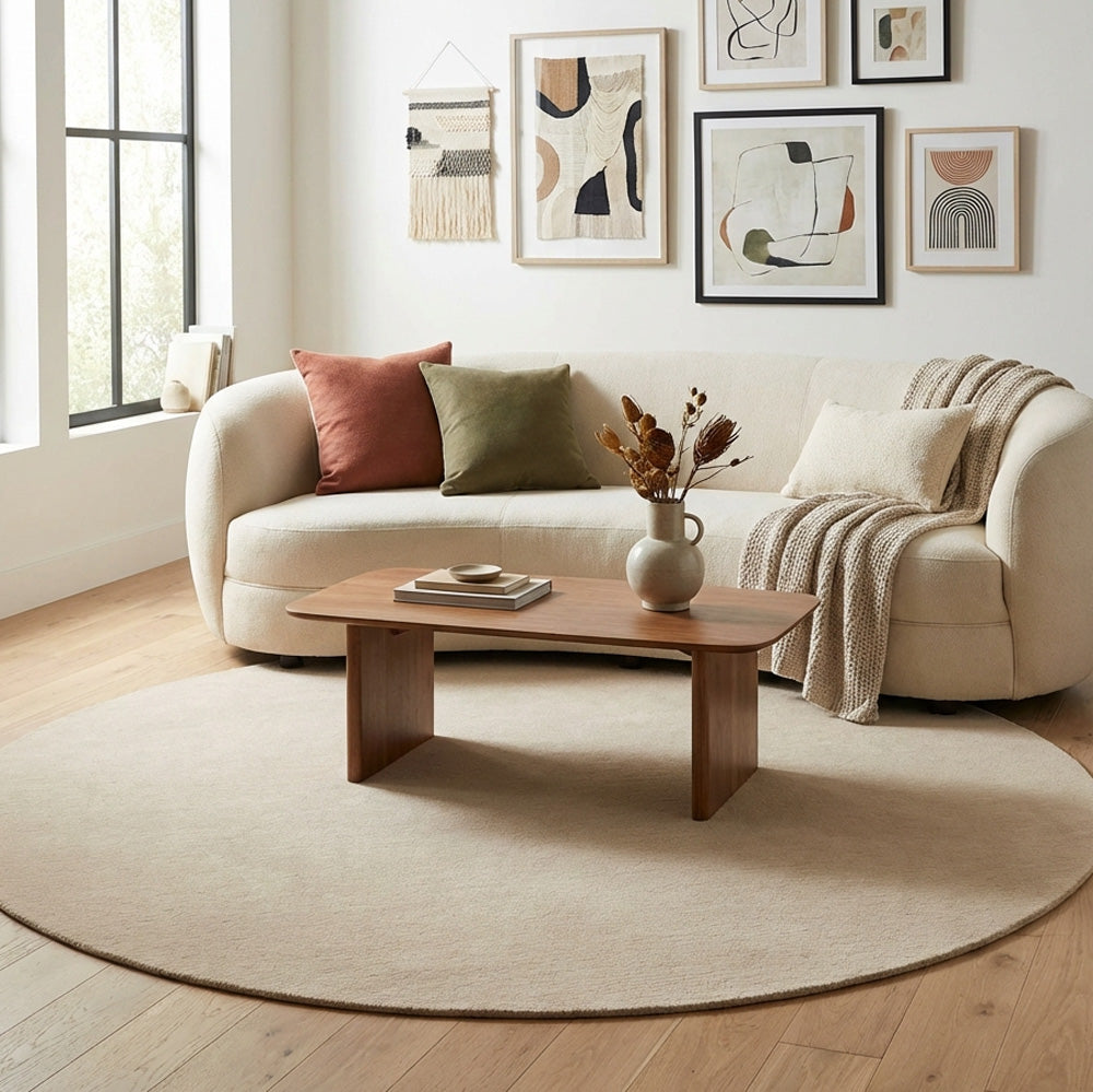 Hand tufted cream round wool rug in modern living room