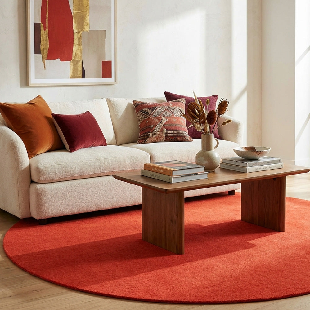 Light red round wool rug in modern living room
