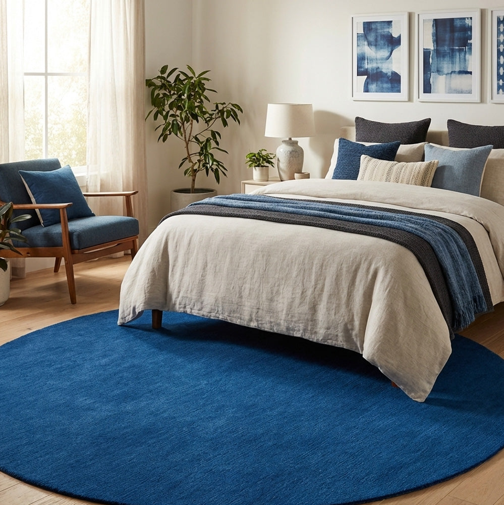 blue round wool rug in bedroom