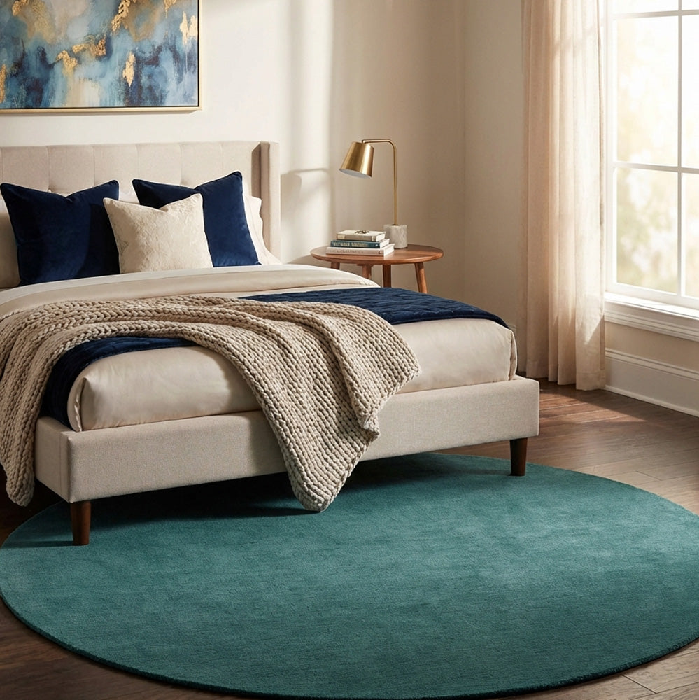 Blue round wool rug in modern bedroom