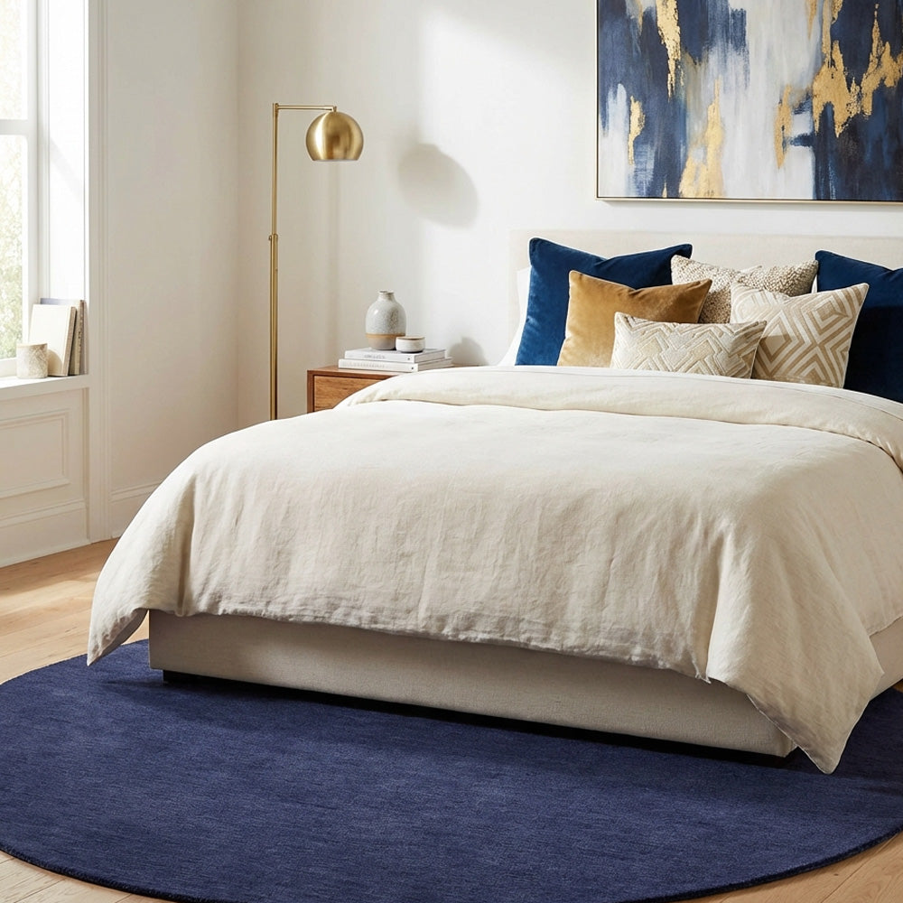Navy blue round wool rug in modern bedroom