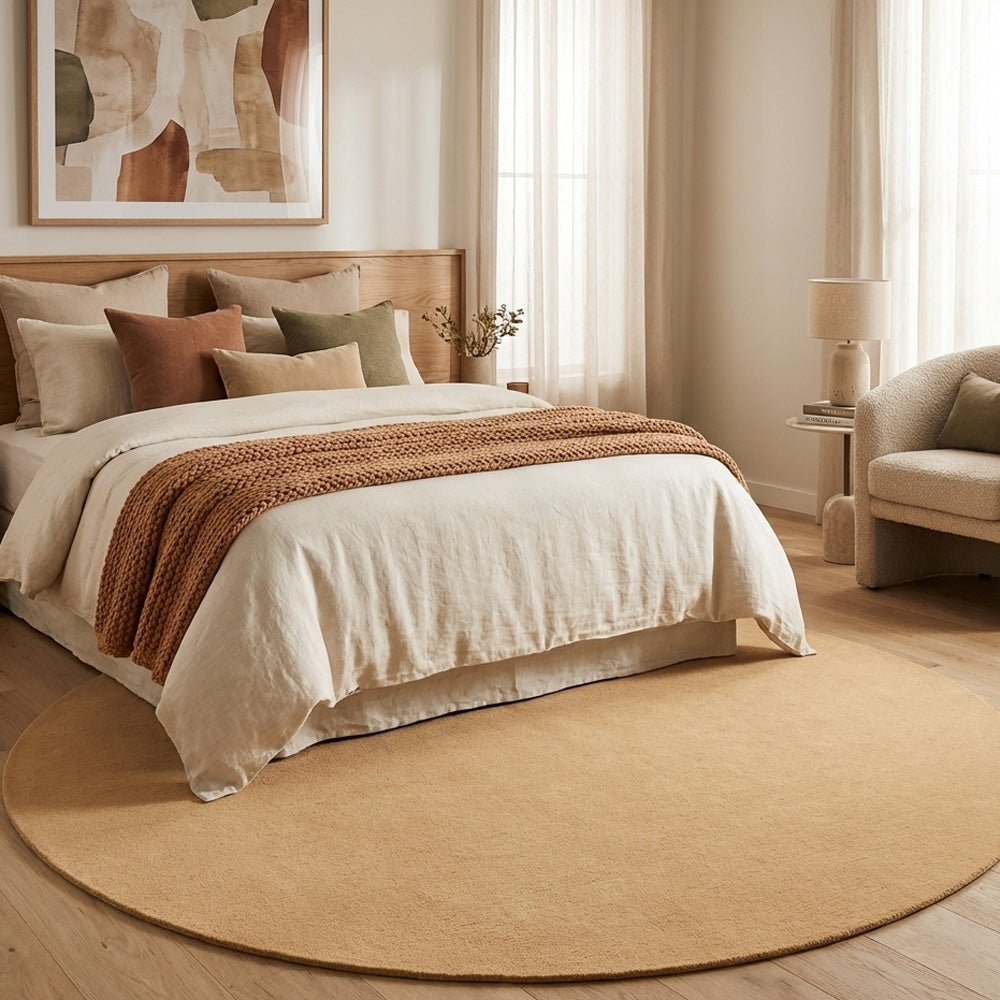 peach round wool rug in modern bedroom
