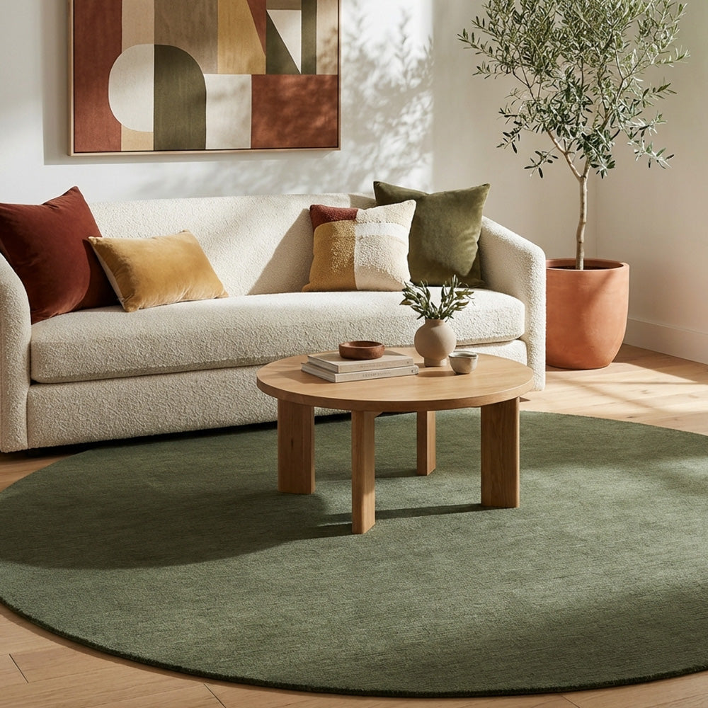 Green round wool rug in living room