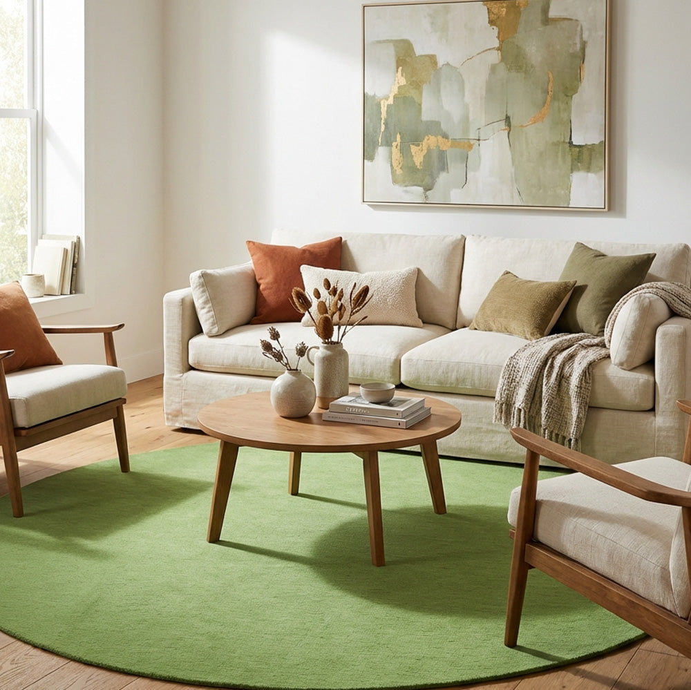 Hand tufted green round wool rug in living room