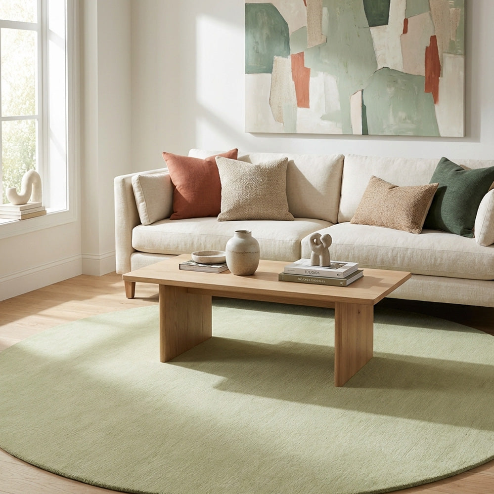 Green round wool rug in living room