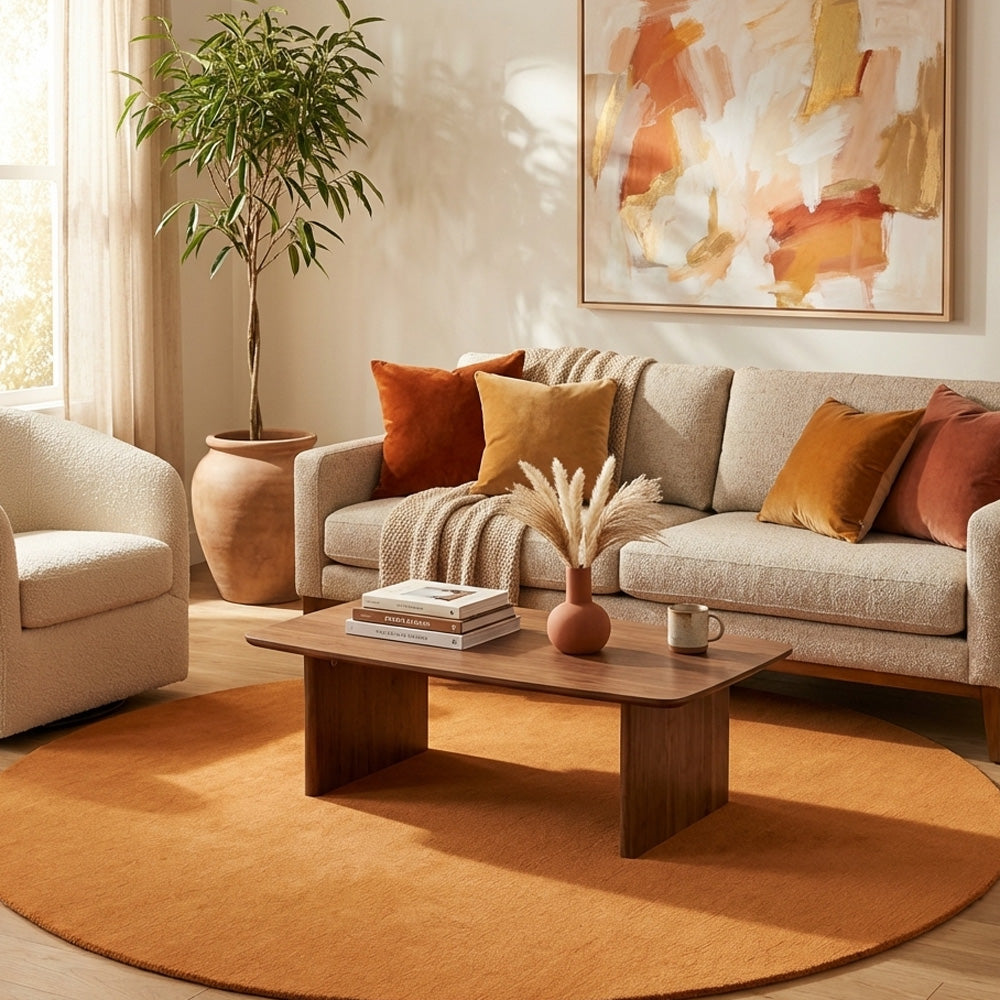 burnt orange round wool rug in contemporary lounge