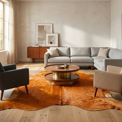 burnt orange cowhide rug in the living room