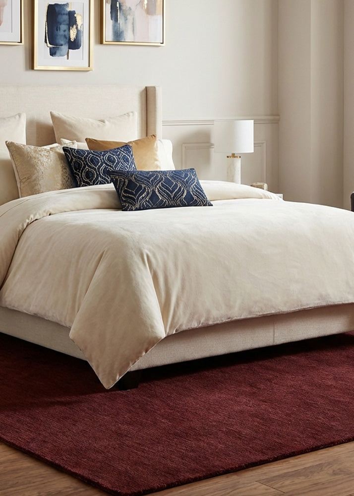 Deep maroon wool rug in modern bedroom