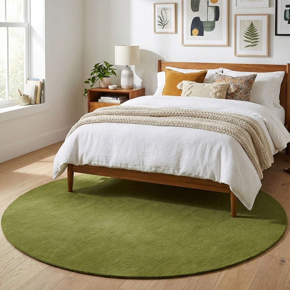 Green round wool rug in modern bedroom