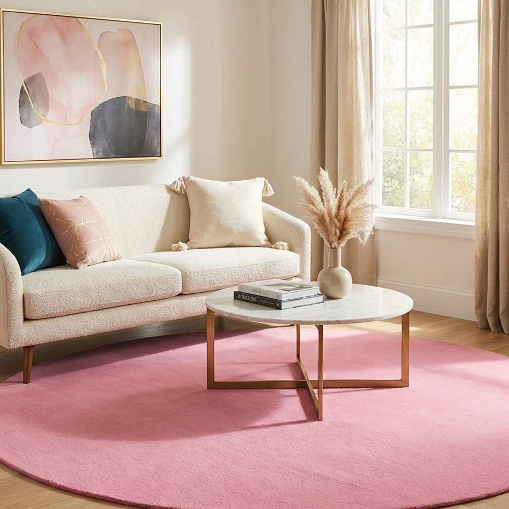 Baby pink round wool rug in modern living room