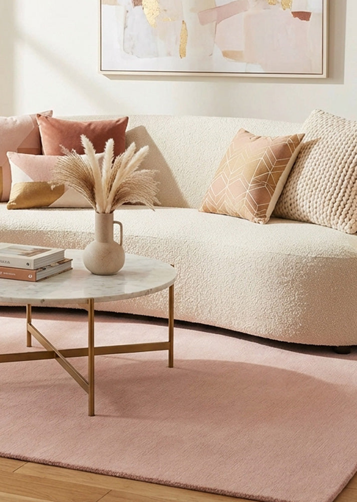 Baby pink wool rug in living room