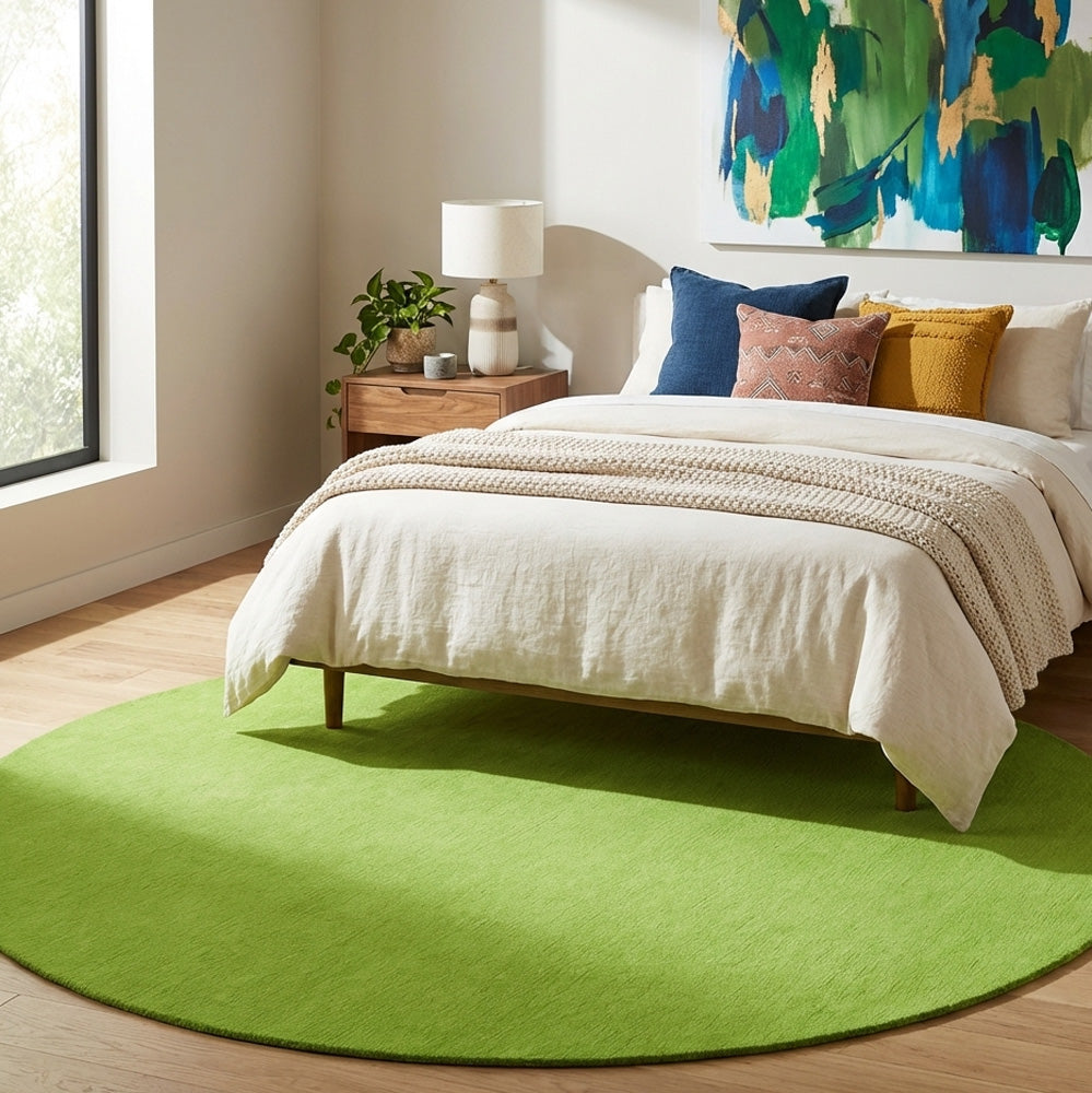 Apple green round wool rug in bedroom