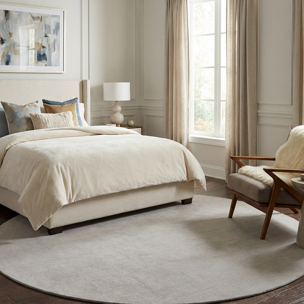 Light grey round wool rug in modern bedroom