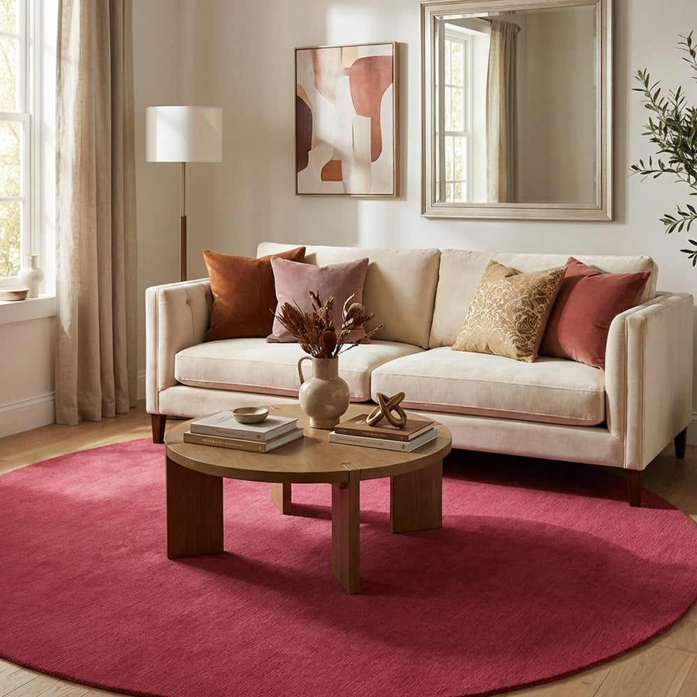 pink round wool rug in living room
