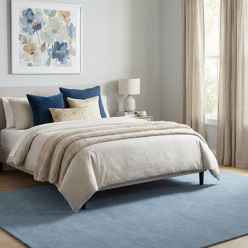 blue wool rug in modern bedroom