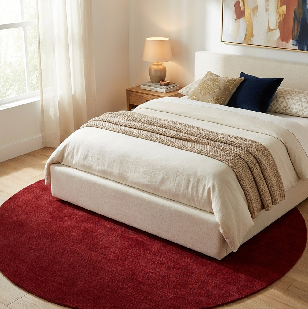Red round wool rug in modern bedroom
