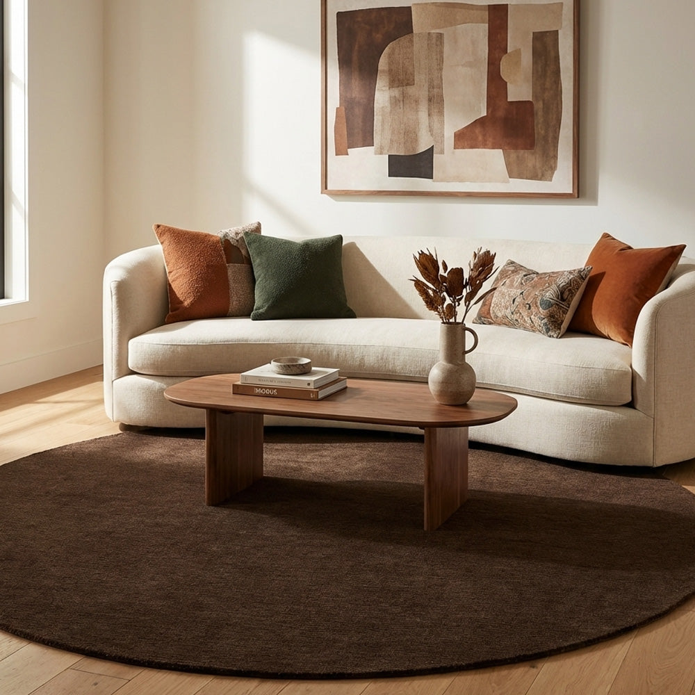 Brown round wool rug in living room