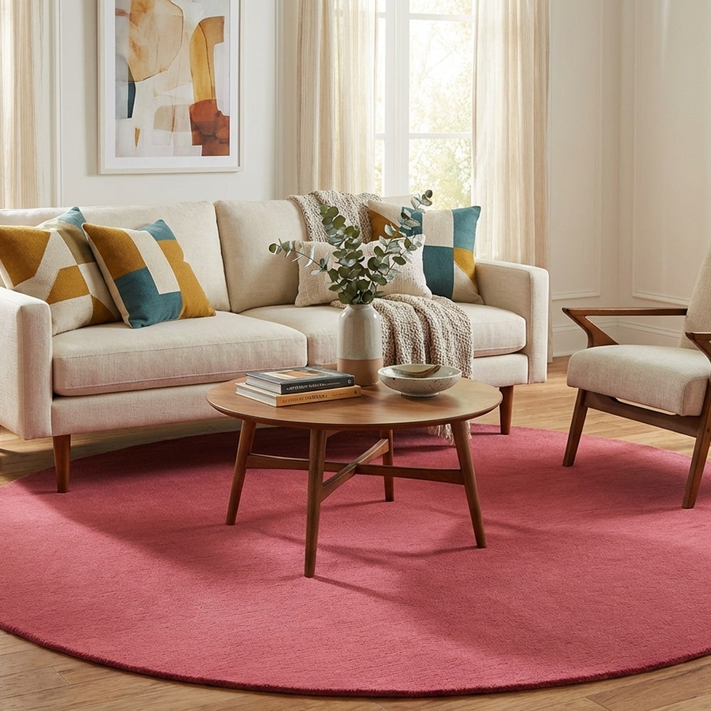 Pink round wool rug in modern living room