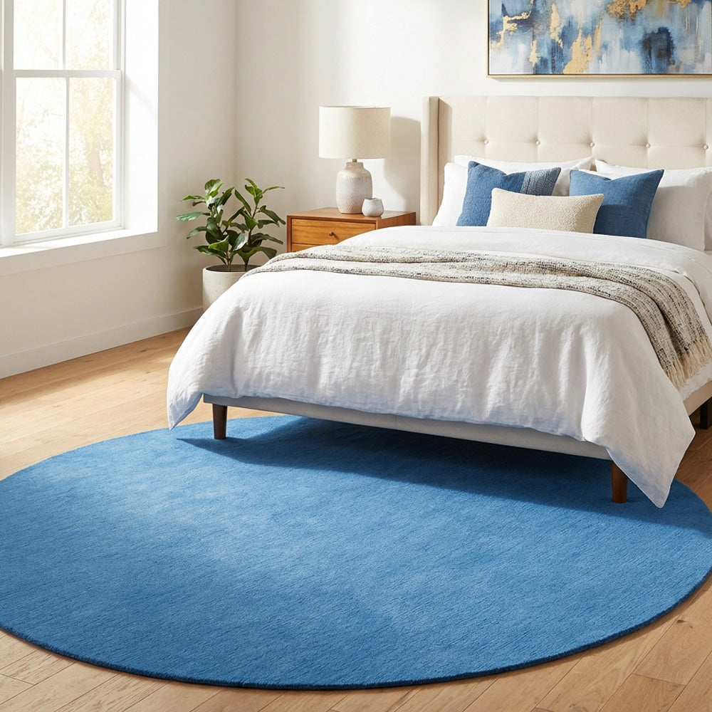 Bright blue round wool rug in modern style bedroom