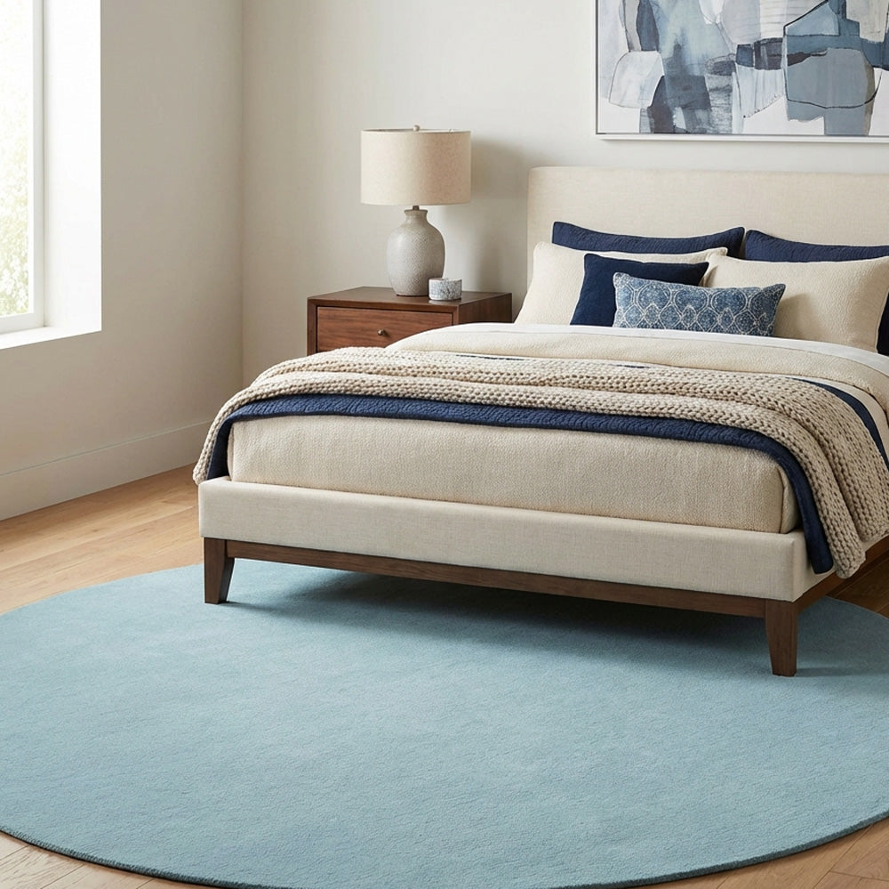 Pastel round wool rug in bedroom