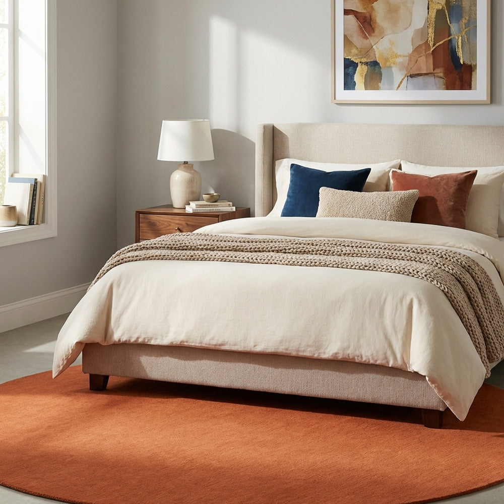 Burnt Orange round wool rug in bedroom