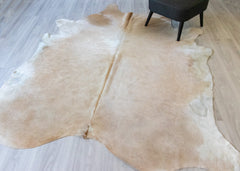 light gold cowhide rug