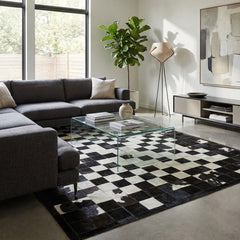 cowhide patchwork rug in chess block pattern in black and white in modern living room