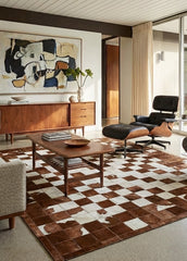 cowhide patchwork rug in block pattern in modern living room