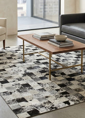 Stitched cowhide rug in living room