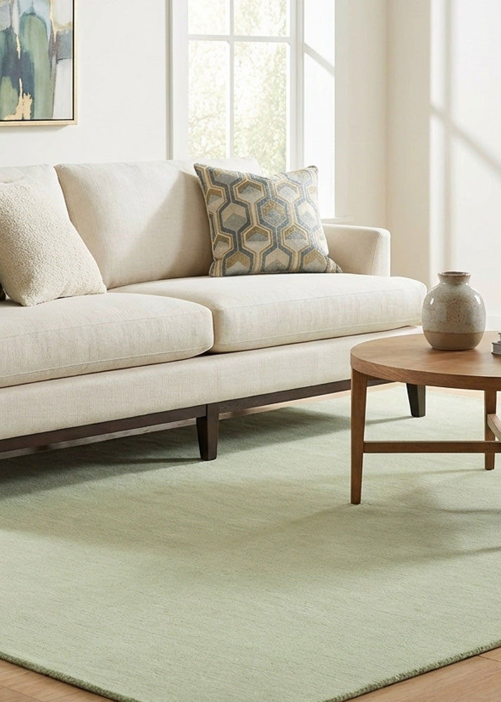 Sage green wool rug in living room