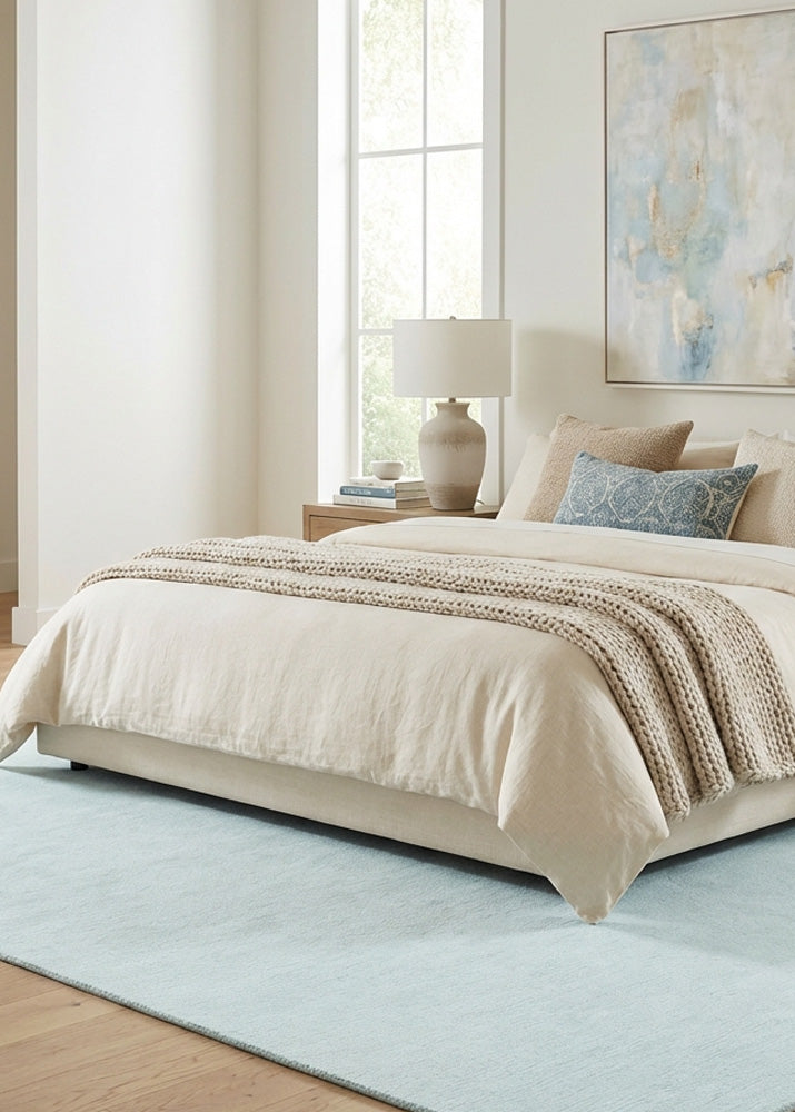 Pastel light blue wool rug in modern bedroom