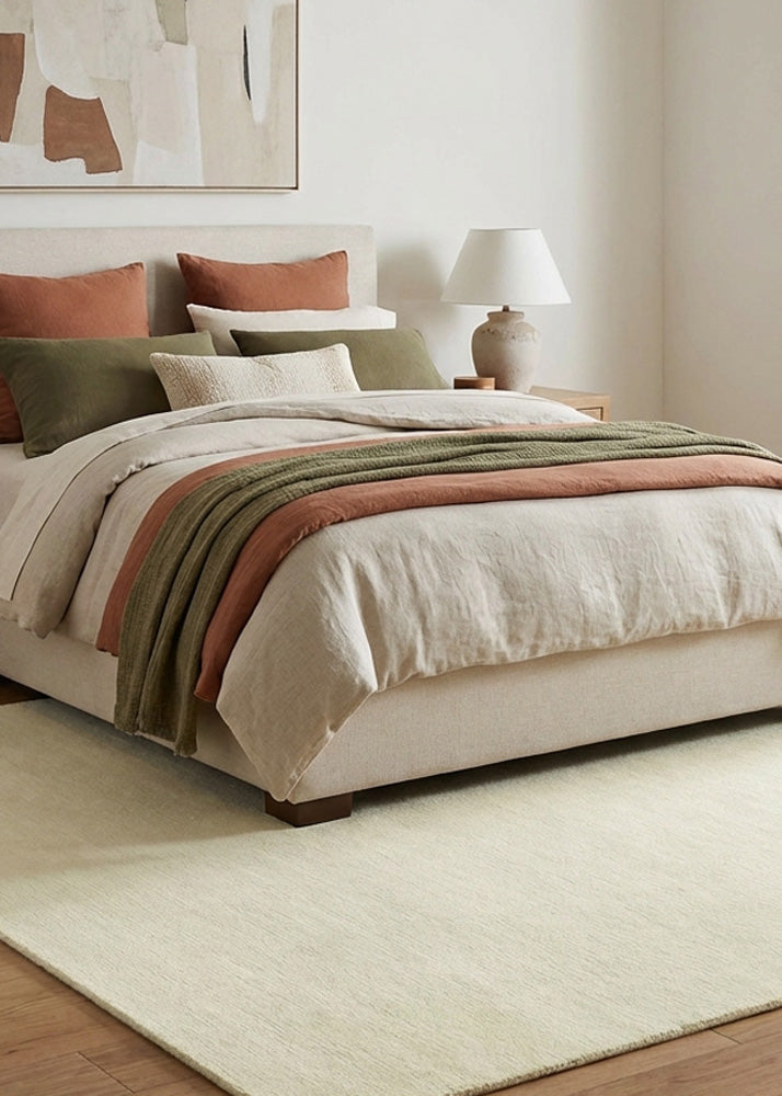 Hand tufted off white wool rug in modern style bedroom