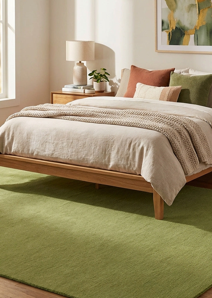 Green wool rug in bedroom