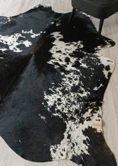 large real cow hide rug on floor